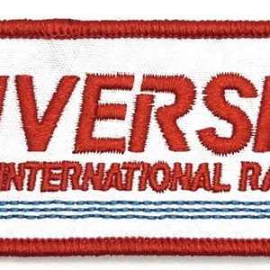 May include: Red embroidered patch with white background. The patch features the text "Riverside International Raceway" with a stylized track design.