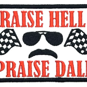 May include: White embroidered patch with black and red text. The text reads "Raise Hell Praise Dale". The patch features a pair of sunglasses, a moustache, and two chequered flags.