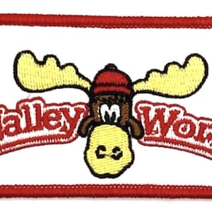 May include: Red and white embroidered patch with a cartoon moose wearing a red hat and the text "Wally World".