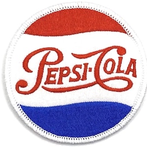 May include: A white, red, and blue circular embroidered patch with the text "Pepsi-Cola" in red cursive lettering.