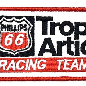 May include: Red, white, and black embroidered patch with the text "Phillips 66 Trop Artic Racing Team".