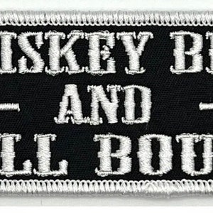 May include: Black and white embroidered patch with the text "Whiskey Bent and Hell Bound".