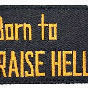 May include: Black embroidered patch with yellow stitching. The patch reads "Born to Raise Hell."