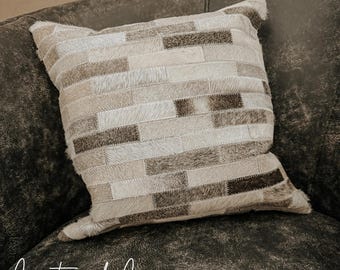 Sierkussenhoes van koeienhuid patchwork