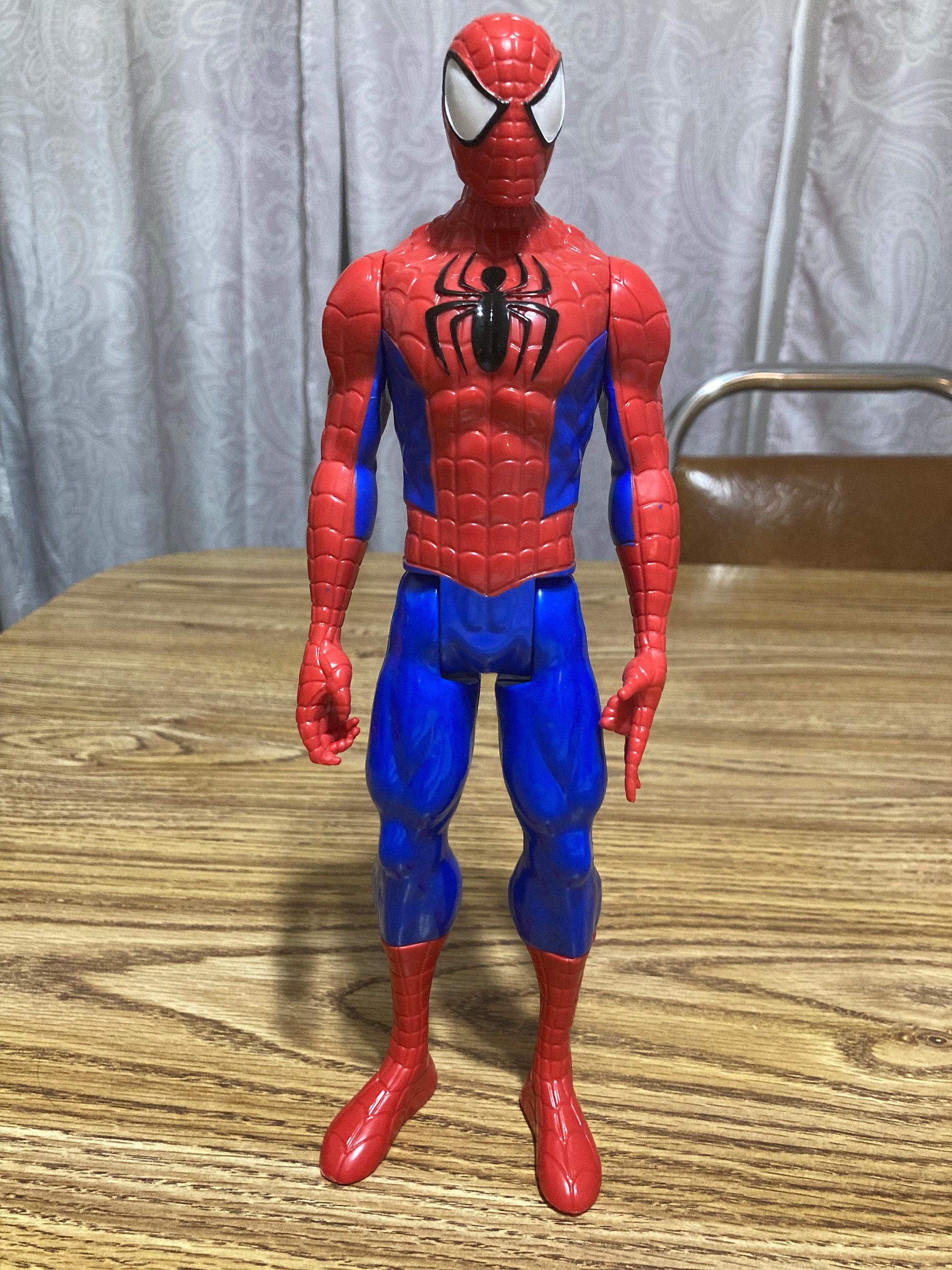 Plastic action figure, a web-slinging Spiderman.