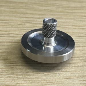 Tungsten spinning top with hand polished base set, average 15-20 minutes, best record 25-30+ minutes
