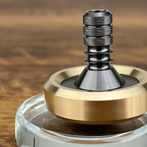 Zirconium Spinning Top, Brass Collar with Zirconium Stem, Average 8-12 Minutes, Best Record 15+ Minutes