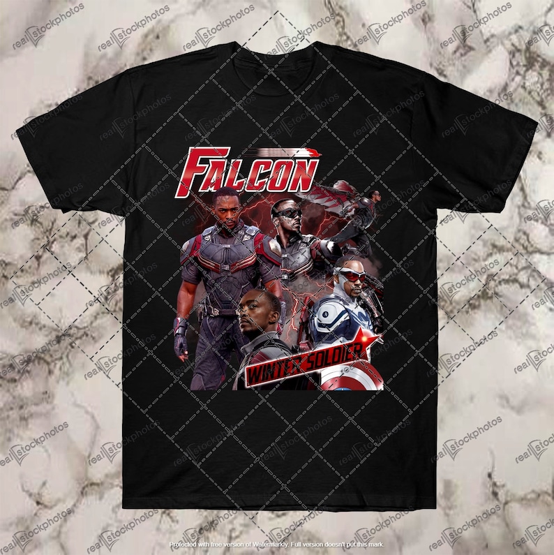 May include: Black t-shirt featuring a graphic of Falcon and Winter Soldier from Marvel's Avengers. The graphic depicts the characters in action poses with the text "FALCON" and "WINTER SOLDIER" in red and white.