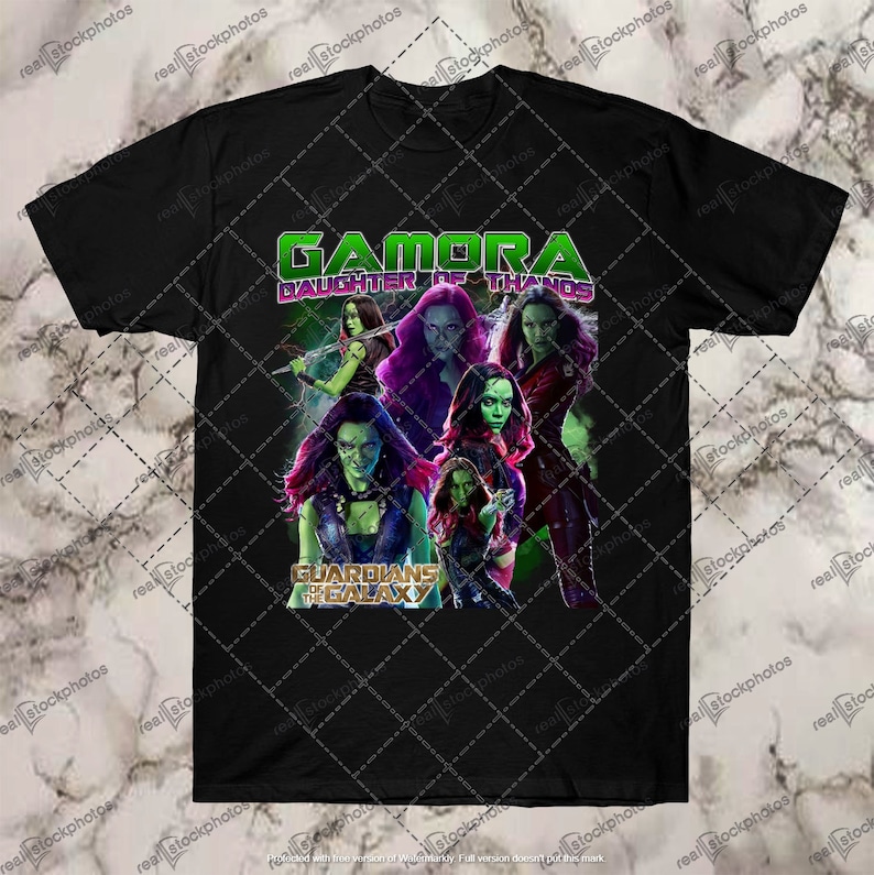 May include: Black t-shirt with a graphic of Gamora from Guardians of the Galaxy. The graphic features Gamora in different poses with the text "Gamora Daughter of Thanos" and "Guardians of the Galaxy".