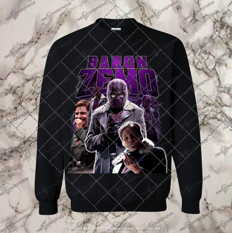 Op de afbeelding: Zwart sweatshirt met een paarse en witte grafische print van Baron Zemo uit het Marvel Cinematic Universe. De afbeelding toont Zemo's masker en een groep personages uit de show.