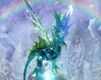 May include: A green glass dragon figurine with iridescent wings, perched on a crystal-like rock formation. The dragon is surrounded by a shimmering rainbow and a sparkling, blue light.