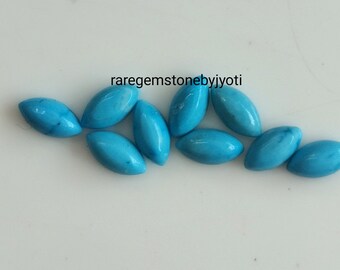 May include: Ten turquoise cabochon stones in a marquise shape. The stones are a light blue color and have a smooth, polished finish.