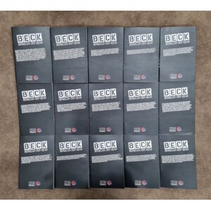 May include: A stack of 15 black books with the title "BECK MONGOLIAN CHOP SQUAD" printed in white on the front cover.