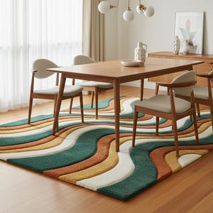A high-quality Mid Century Modern hand tufted wool rug featuring a 3D abstract wave design in burnt orange, deep forest green, mustard yellow, and cream. The shag area rug has a plush multi-level pile and is styled on a wooden floor in a minimalist living room with vintage furniture.