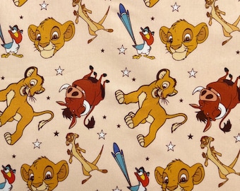 May include: A repeating pattern featuring characters from The Lion King. The design includes Simba, Timon, Pumbaa, Zazu, and stars on a light tan background. The characters are in various poses, with Simba's head and full body featured.