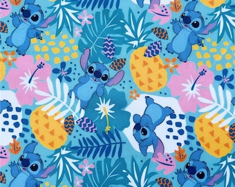 May include: Blue and white fabric with a repeating pattern of Stitch, the character from Lilo & Stitch, on a blue background with tropical leaves and pineapples.