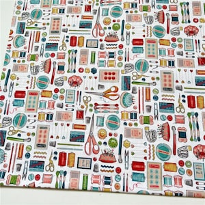 May include: White fabric with a repeating pattern of colorful sewing supplies, including spools of thread, buttons, needles, scissors, and thimbles. The pattern is on a white background.