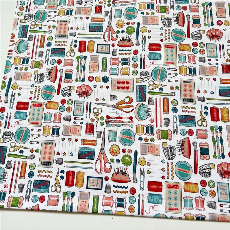 May include: White fabric with a repeating pattern of colorful sewing supplies, including spools of thread, buttons, needles, scissors, and thimbles. The pattern is on a white background.