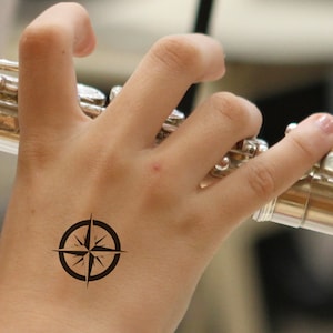 COMPASS Rose temporary tattoo in black. The word compass means to step together or to journey together.