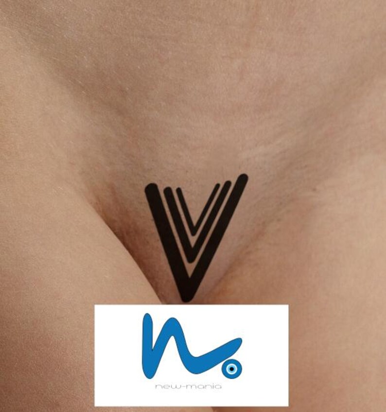 May include: A black tattoo design of three overlapping V shapes on a person's body.