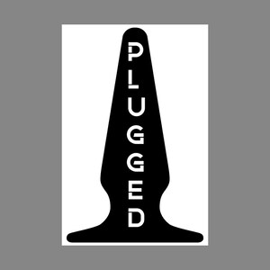 May include: A black, tapered, conical object with a flared base, featuring the word PLUGGED written vertically in white capital letters down the centre. The design is symmetrical, with a smooth silhouette and a rounded tip at the top.