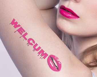 May include: A temporary tattoo applied to skin featuring the word WELGUM in a bright pink, dripping font style. Next to the text is a graphic illustration of a pair of bright pink lips with white teeth visible, matching the color of the lettering.