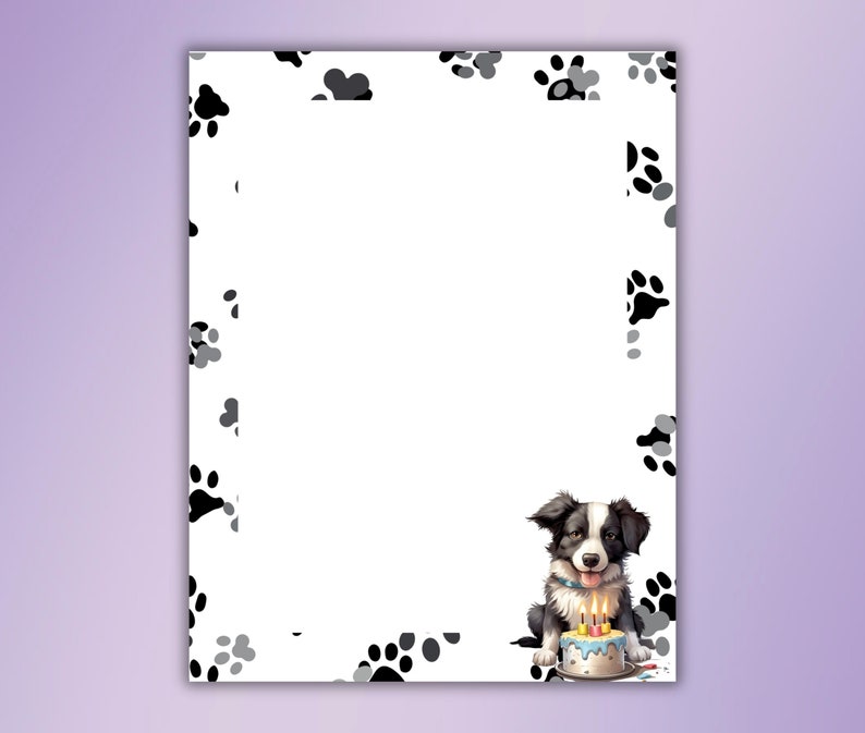 May include: A black and white border collie puppy sits with a birthday cake with candles. The background is white with black paw prints.