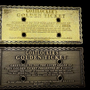May include: Two rectangular, gold-colored metal plaques with ornate borders. The text "GOATLOCKER'S GOLDEN TICKET" is displayed on each, along with additional engraved text. The plaques have four holes and a dark background.