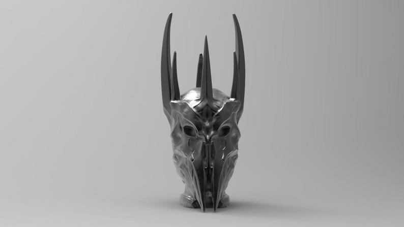 May include: A silver-colored helmet with a crown of sharp points. The helmet has a menacing, almost skeletal appearance.
