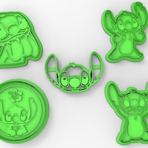 May include: Set of five green plastic cookie cutters shaped like Stitch from the Disney movie Lilo & Stitch. The cutters feature Stitch in different poses, including with his arms raised, with his arms crossed, and with his hands on his hips.