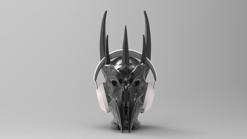 May include: A black and silver crown with horns, wearing white headphones. The crown is a popular fantasy character.