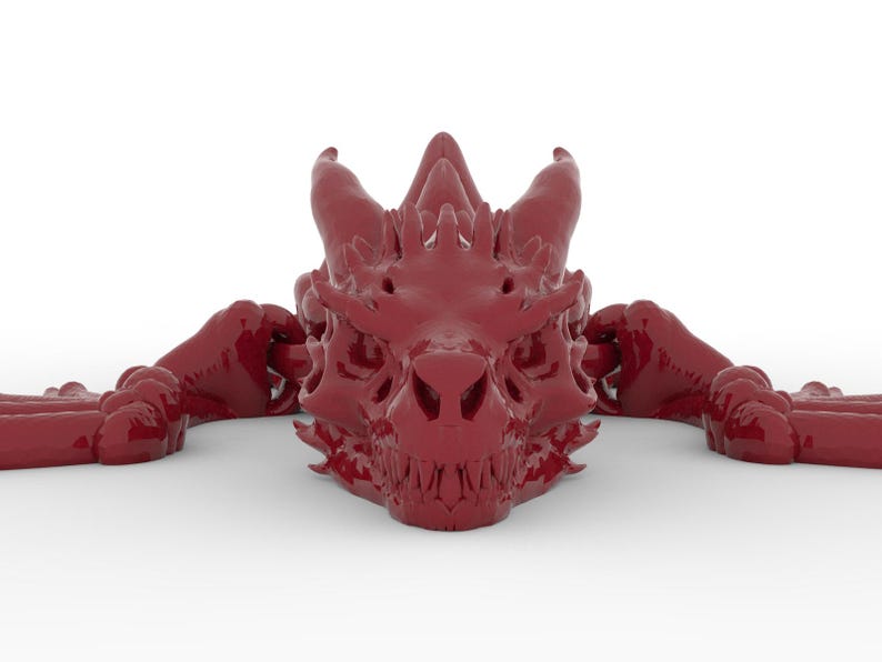 May include: A detailed, glossy, burgundy-colored dragon head sculpture. The dragon's head features sharp teeth, horns, and intricate facial details. The sculpture is positioned on a white background, showcasing the dragon's form.