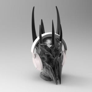 May include: A black and white sculpture of a head wearing white headphones. The sculpture has a crown of sharp points.