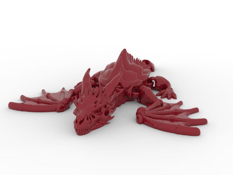 May include: A maroon-colored dragon figurine with detailed wings, claws, and a spiky spine. The dragon is lying down, with its wings spread out to the sides. The figurine is a fantasy-themed collectible.