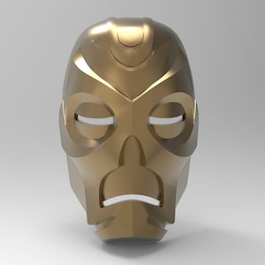 May include: A gold-colored mask with a geometric design. The mask has two eye holes and a mouth hole. The mask is made of a smooth, shiny material.