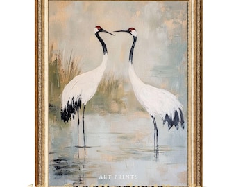 May include: Framed art print featuring two white cranes with black wingtips and red crowns, standing in water. The painting has a soft, muted color palette with the text "ART PRINTS" and "GOGH STUDIO" at the bottom.