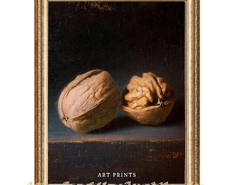 May include: A framed art print featuring two walnuts, one whole and one halved, set against a dark background. The print has a gold-colored ornate frame and includes the text "ART PRINTS" and "GOGH STUDIO".