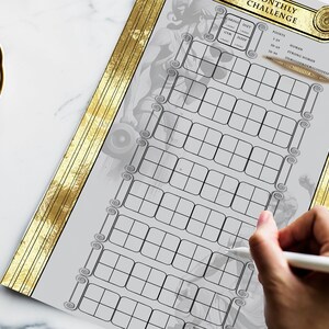 May include: A printable monthly fitness challenge tracker with a gold border and a stylised image of a person lifting weights. The tracker has a grid of squares for marking off days of the month.