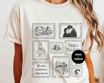 May include: A beige t-shirt with a graphic print of various images from the novel Pride and Prejudice. The images include a house, a couple, a bust, a teacup, a stack of books, and an eye. The text "Pride & Prejudice" and "Prose + Threads" are also included in the graphic.
