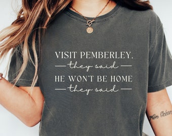 May include: A dark gray t-shirt with the text "VISIT PEMBERLEY, -they said- HE WON'T BE HOME -they said- "