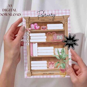 May include: A printable A5 February calendar featuring a pink and white gingham background with a vintage-style wooden bookshelf illustration. The bookshelf has shelves filled with books, a potted plant, and a small clock with the date "Feb 14" on it. The text "Prose + Threads" is at the bottom of the image.
