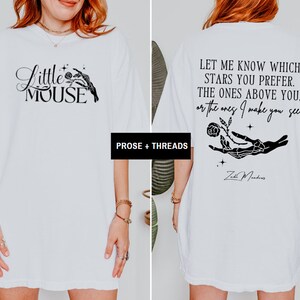 May include: White t-shirt with black graphic text and illustrations. The front features "Little Mouse" with a hand holding a rose. The back displays the quote "Let me know which stars you prefer..." with a hand holding a rose.