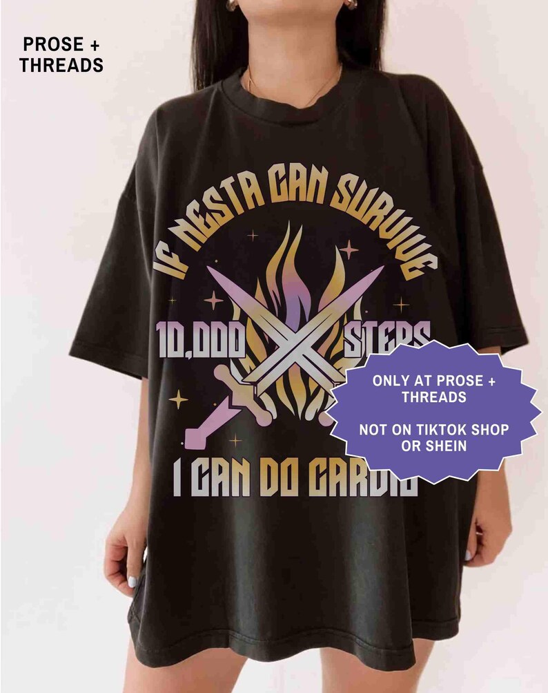 May include: Black t-shirt with the text "IF NESTA CAN SURVIVE 10,000 STEPS I CAN DO CARDIO" in a stylized font. The design includes crossed swords and a flame-like graphic. The shirt also has the text "ONLY AT PROSE + THREADS" and "NOT ON TIKTOK SHOP OR SHEIN".