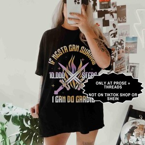 May include: Black t-shirt with the text "IF NESTA CAN SURVIVE 10,000 STEPS I CAN DO CARDIO" and a graphic of crossed swords and flames. The shirt also has the text "ONLY AT PROSE + THREADS NOT ON TIKTOK SHOP OR SHEIN".
