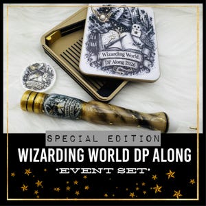 May include: A special edition "Wizarding World DP Along" event set. The set includes a wand, a coaster, and a decorative box with a graphic of a book, owl, and the text "Wizarding World. DP Along 2026".