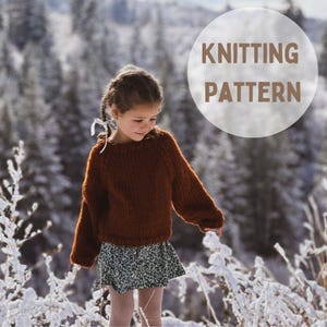 May include: A girl wearing a brown knitted sweater with a floral skirt and pink tights stands in a snowy forest. The text "Knitting Pattern" is superimposed on the image.