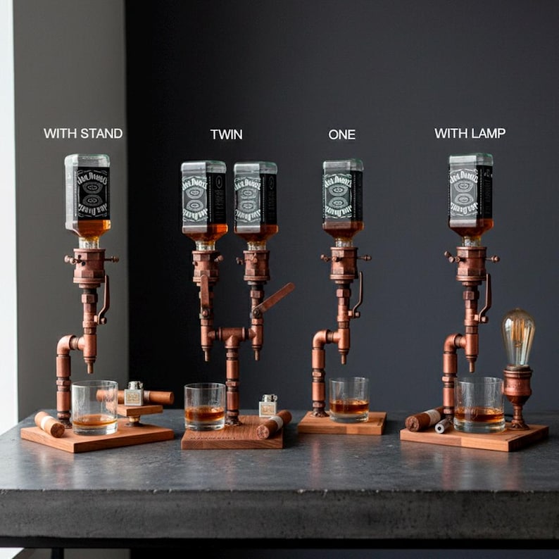 May include: A collection of copper and wood liquor dispensers, each holding a Jack Daniel's bottle. The dispensers are mounted on wooden bases, with glasses and accessories. One dispenser includes a vintage-style light bulb.