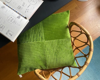 Cushion cover in green corduroy and green textured fabric