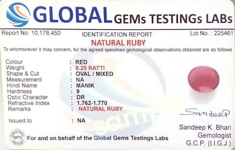 May include: A gemological report for a natural ruby gemstone. The report includes details such as color, weight, shape, cut, measurement, Hindi name, hardness, optic character, refractive index, and remarks. The report is issued by Global Gems Testings Labs and signed by Sandeep K. Bhari, Gemologist, G.C.P. (I.I.G.J.).