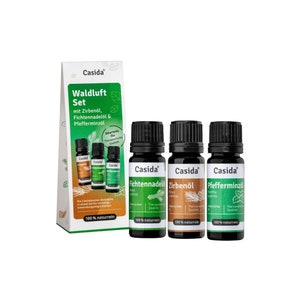 Könnte beinhalten: Ein Set mit drei 100% natürlichen ätherischen Ölflaschen mit den Bezeichnungen "Fichtennadelöl", "Zirbenöl" und "Pfefferminzöl" mit einem grün-braunen Etikettendesign. Die Flaschen sind in einer Schachtel mit dem Text "Waldluft Set" und "Casida" auf der Vorderseite verpackt.